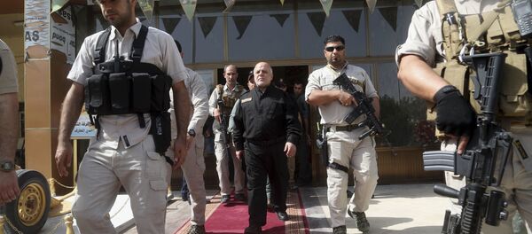 Iraq Prime Minister Haider al-Abadi, center, surrounded by his guards (File) Iraq Prime Minister Haider al-Abadi, center, surrounded by his guards (File) - Sputnik International