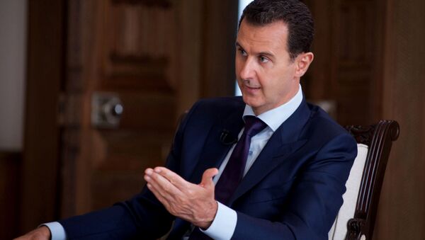 In this photo released on July 1, 2016, by the Syrian official news agency SANA, Syrian President Bashar Assad speaks during an interview with Australia's SBS news channel, in Damascus, Syria - Sputnik International