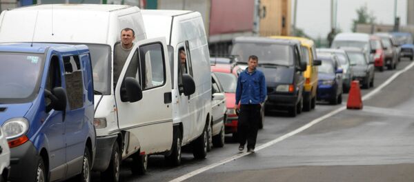 Cars queu at the Shegyni checkpoint on the border with Ukraine and Poland some 100kms from the western Ukrainian city of Lviv (File) Cars queu at the Shegyni checkpoint on the border with Ukraine and Poland some 100kms from the western Ukrainian city of Lviv (File) - Sputnik International