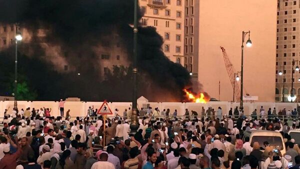Muslim worshippers gather after a suicide bomber detonated a device near the security headquarters of the Prophet's Mosque in Medina, Saudi Arabia, July 4, 2016 - Sputnik International