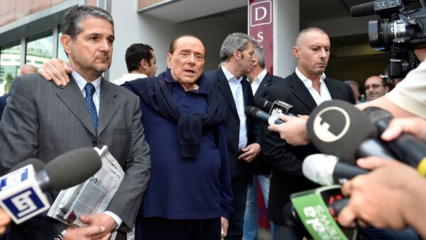 Italian tycoon and former prime minister Silvio Berlusconi talks with reporters as he leaves the hospital after a heart surgery in Milan, Italy July 5, 2016 - Sputnik International