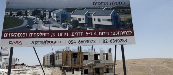 A picture taken on July 4, 2016, shows buildings under construction in the Israeli settlement of Maale Adumim, east of Jerusalem in the occupied West Bank. A picture taken on July 4, 2016, shows buildings under construction in the Israeli settlement of Maale Adumim, east of Jerusalem in the occupied West Bank. - Sputnik International