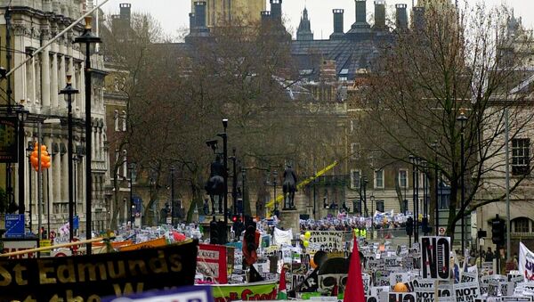 Opponents of the US-led war on Iraq demonstrate en masse in central London 15 February 2003 as tens of thousands of anti-war demonstrators around the world took the streets. - Sputnik International