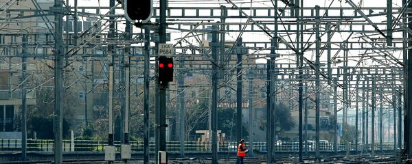 A construction worker walks amongst rail tracks during a Greek railway strike (File) A construction worker walks amongst rail tracks during a Greek railway strike (File) - Sputnik International