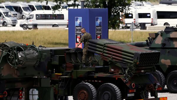 A file photo showing a Polish soldier prepares a military exhibition in front of the venue of the NATO Summit - Sputnik International