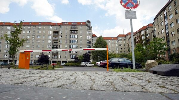 A parking lot and housing area in the German capital Berlin is seen on Tuesday, Sept. 14, 2004. Nothing on this parking area in the city's center reminds a viewer of former German Nazi-leader Adolf Hitler's bunker which was located here and the bunker's exit, where Hitler and his wife Eva were burned by aides after committing suicide. After WW II, East Germany built up a housing area on the site of the bunker. - Sputnik International
