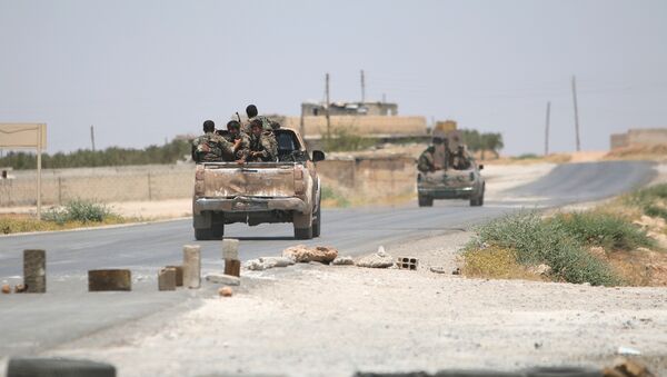 Syria Democratic Forces (SDF) ride vehicles along a road near Manbij, in Aleppo Governorate, Syria, June 25, 2016. - Sputnik International