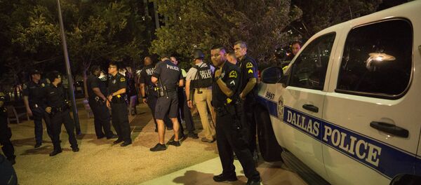 Police cars sit on Main Street in Dallas following the sniper shooting during a protest on July 7, 2016. Police cars sit on Main Street in Dallas following the sniper shooting during a protest on July 7, 2016. - Sputnik International