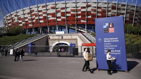 People walk outside PGE National Stadium, the venue of the NATO Summit, in Warsaw, Poland July 8, 2016. - Sputnik International