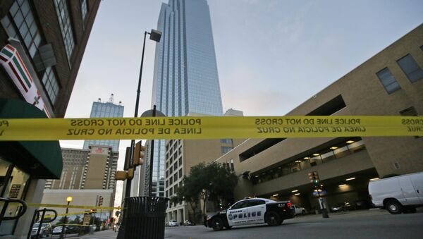 Police tape marks off the area where a shooting took place in downtown Dallas, Friday, July 8, 2016. - Sputnik International