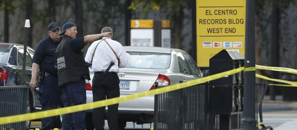 Crime scene investigators survey the area after a shooting in downtown Dallas, Friday, July 8, 2016. Crime scene investigators survey the area after a shooting in downtown Dallas, Friday, July 8, 2016. - Sputnik International