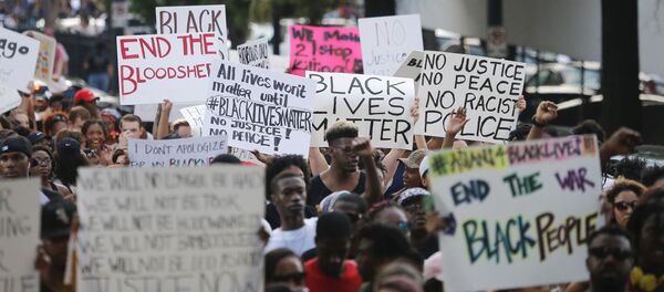 Demonstrators march through downtown Atlanta to protest the shootings of two black men by police officers, Friday, July 8, 2016. Demonstrators march through downtown Atlanta to protest the shootings of two black men by police officers, Friday, July 8, 2016. - Sputnik International