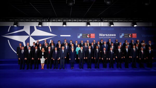 NATO heads of state and other leaders participate in a family photo at the NATO Summit in Warsaw, Poland July 8, 2016. - Sputnik International