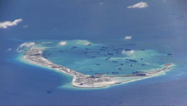 Chinese dredging vessels in the waters around Mischief Reef in the disputed Spratly Islands in the South China Sea, photographed by a USN surveillance aircraft in 2015. - Sputnik International