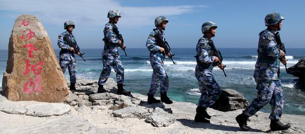 Soldiers of China's People's Liberation Army (PLA) Navy patrol at Woody Island, in the Paracel Archipelago, which is known in China as the Xisha Islands, January 29, 2016. Soldiers of China's People's Liberation Army (PLA) Navy patrol at Woody Island, in the Paracel Archipelago, which is known in China as the Xisha Islands, January 29, 2016. - Sputnik International