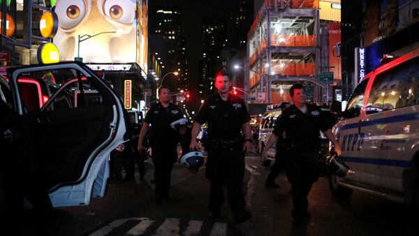NYPD officers keep an eye on protesters as they go through Times Square taking part in a protest against the killing of Alton Sterling, Philando Castile and in support of Black Lives Matter during a march along Manhattan's streets in New York July 8, 2016. - Sputnik International