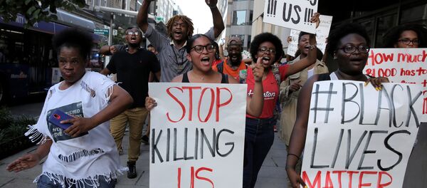 Demonstrators with Black Lives Matter march during a protest in Washington, U.S., July 8, 2016. Demonstrators with Black Lives Matter march during a protest in Washington, U.S., July 8, 2016. - Sputnik International