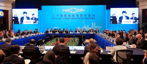 Attendees listen to a speech by China's Commerce Minister Gao Hucheng during the opening ceremony of the 2016 G20 Trade Ministers Meeting in Shanghai, China July 9, 2016. - Sputnik International