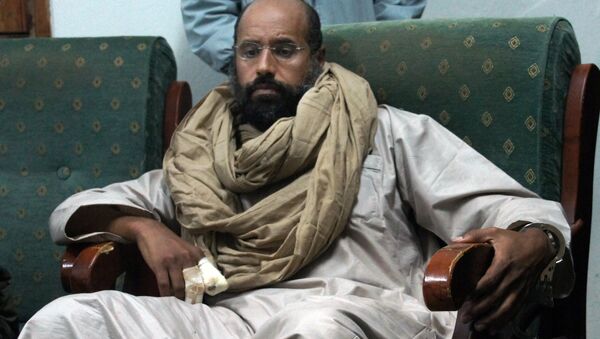 In this Saturday, Nov. 19, 2011 file photo, Seif al-Islam is seen after his capture in the custody of revolutionary fighters in Zintan. - Sputnik International