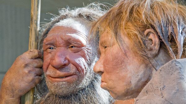 The prehistoric Neanderthal man N, left, is visited for the first time by another reconstruction of a homo neanderthalensis called Wilma, right, at the Neanderthal museum in Mettmann, Germany, Friday, March 20, 2009 - Sputnik International