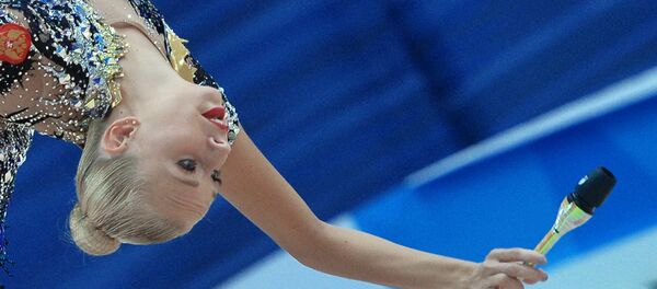 Russia's Yana Kudryavtseva performs a clubs routine during individual all-around at the 2016 Rhythmic Gymnastics World Cup Series in Kazan, Russia Russia's Yana Kudryavtseva performs a clubs routine during individual all-around at the 2016 Rhythmic Gymnastics World Cup Series in Kazan, Russia - Sputnik International