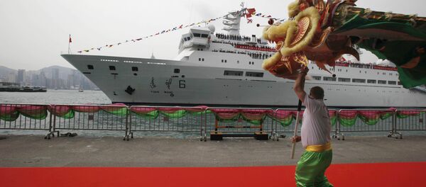 A man performs dragon dance as China's Yuanwang-6 space tracking ship is docked in Hong Kong's Victoria Harbor (File) A man performs dragon dance as China's Yuanwang-6 space tracking ship is docked in Hong Kong's Victoria Harbor (File) - Sputnik International