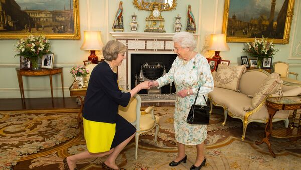 Queen Elizabeth II welcomes Theresa May, left, at the start of an audience in Buckingham Palace, London, where she invited the former Home Secretary to become Prime Minister and form a new government, Wednesday July 13, 2016 - Sputnik International