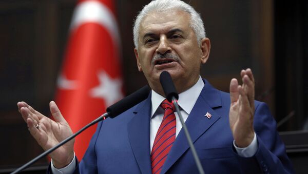 Turkey's Prime Minister Binali Yildirim addresses lawmakers at the parliament a day after he announced the details of an agreement reached with Israel. - Sputnik International