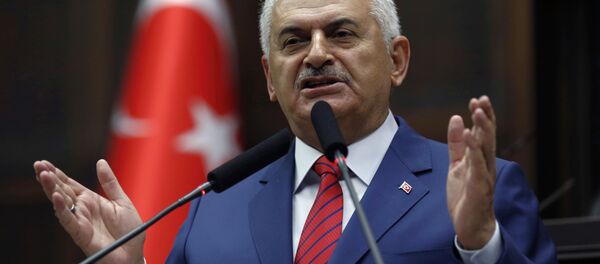 Turkey's Prime Minister Binali Yildirim addresses lawmakers at the parliament a day after he announced the details of an agreement reached with Israel. Turkey's Prime Minister Binali Yildirim addresses lawmakers at the parliament a day after he announced the details of an agreement reached with Israel. - Sputnik International