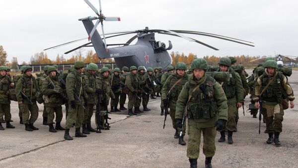 Paratroopers gathered round a Mil Mi-26 helicopter during drills involving the airforce of the Western Military District, Pskov Region, Russia - Sputnik International