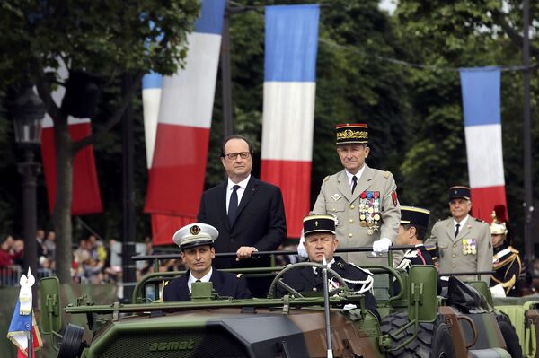 French President Francois Hollande (L) and Chief of the Defense Staff French Army General Pierre de Villiers arrive in a command car for the annual Bastille Day military parade on the Champs Elysees avenue in Paris, France, July 14, 2016. French President Francois Hollande (L) and Chief of the Defense Staff French Army General Pierre de Villiers arrive in a command car for the annual Bastille Day military parade on the Champs Elysees avenue in Paris, France, July 14, 2016. - Sputnik International