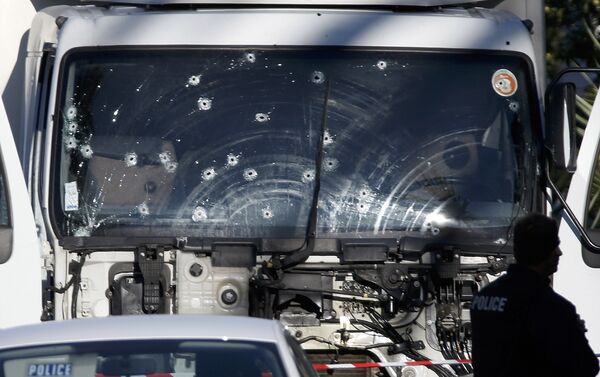 Bullet imacts are seen on the heavy truck the day after it ran into a crowd at high speed killing scores celebrating the Bastille Day July 14 national holiday on the Promenade des Anglais in Nice, France, July 15, 2016. - Sputnik International