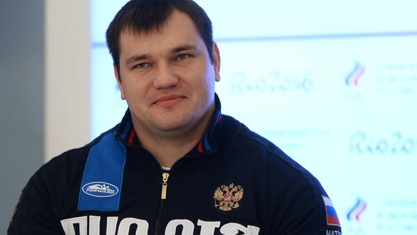 Russian weightlifter Alexei Lovchev at a news conference by the Russian Weightlifting Federation in Moscow. - Sputnik International