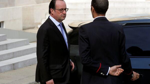 French President Francois Hollande leaves the Elysee Palace in Paris, France, July 15, 2016, after attending an emergency defence meeting the day after the Bastille Day truck attack in Nice. - Sputnik International