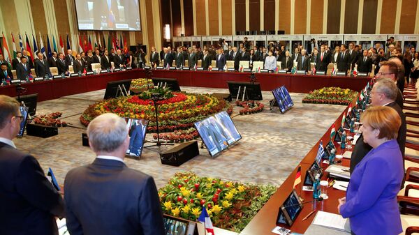 Leaders stand for a minute of silence for the victims of a deadly attack in the French city of Nice, before the opening session of the Asia-Europe Meeting (ASEM) summit in Ulaanbaatar, Mongolia, July 15, 2016 - Sputnik International