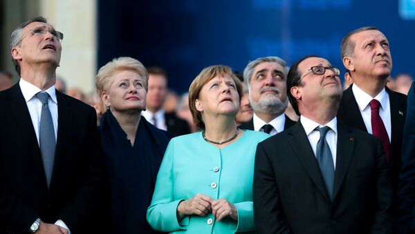 From left, NATO Secretary General, Lithuanian President Dalia Grybauskaite, German Chancellor Angela Merkel, French President Francois Hollande and Turkey’s President Recep Tayyip Erdogan watch a fly-past by NATO air forces planes during the NATO summit in Warsaw, Poland, Friday, July 8, 2016. - Sputnik International
