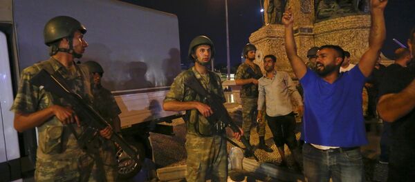 People demonstrate in front of the Republic Monument at the Taksim Square in Istanbul. - Sputnik International