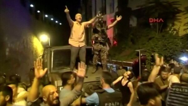 Still Frame Taken From Video Shows A Soldier And A Man On A Military Vehicle trying to calm AK Party Supporters During An Attempted Coup In Istanbul - Sputnik International