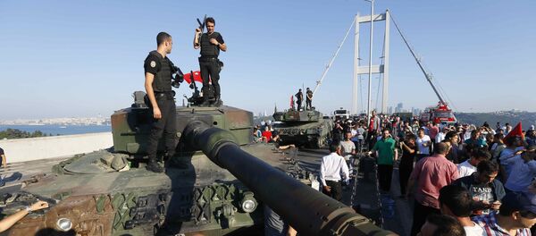 Policemen stand on a military vehicle after troops involved in the coup surrendered on the Bosphorus Bridge in Istanbul, Turkey July 16, 2016. Policemen stand on a military vehicle after troops involved in the coup surrendered on the Bosphorus Bridge in Istanbul, Turkey July 16, 2016. - Sputnik International