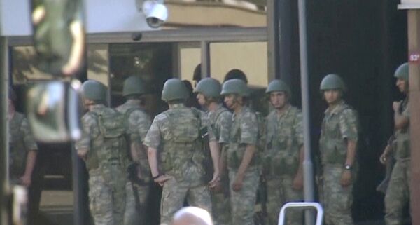 still image from video shows armed soldiers waiting at the entrance of TRT state television as they prepare to surrender to the police after a failed coup attempt, in Istanbul, Turkey July 16, 2016 still image from video shows armed soldiers waiting at the entrance of TRT state television as they prepare to surrender to the police after a failed coup attempt, in Istanbul, Turkey July 16, 2016 - Sputnik International