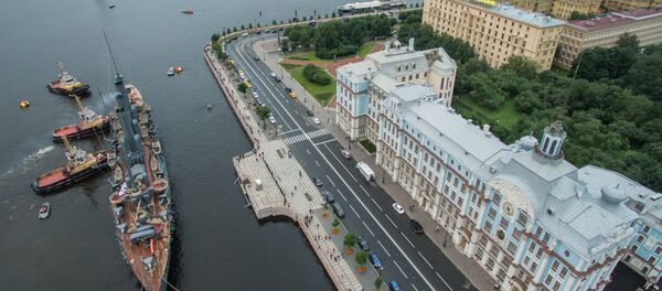Cruiser Aurora towed to permanent mooring at Petrovskaya Embankment Cruiser Aurora towed to permanent mooring at Petrovskaya Embankment - Sputnik International