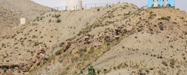 Supreme leaders of Iran, the late Ayatollah Ruhollah Khomeini (L) and Ayatollah Ali Khameni (R), are seen on the top of a hill from the Turkish side of the border near the Esendere crossing between Turkey and Iran Supreme leaders of Iran, the late Ayatollah Ruhollah Khomeini (L) and Ayatollah Ali Khameni (R), are seen on the top of a hill from the Turkish side of the border near the Esendere crossing between Turkey and Iran - Sputnik International