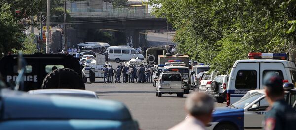 Policemen block a street after group of armed men seized a police station along with an unknown number of hostages, according the country's security service, in Yerevan, Armenia, July 17, 2016. Policemen block a street after group of armed men seized a police station along with an unknown number of hostages, according the country's security service, in Yerevan, Armenia, July 17, 2016. - Sputnik International