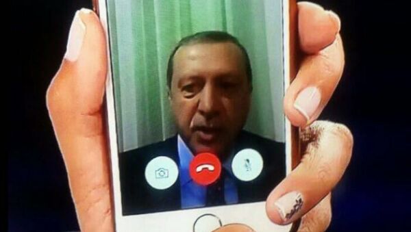 Telephone statement by Turkish President Recep Tayyip Erdogan, shown on the news on TV at an Istanbul home. - Sputnik International