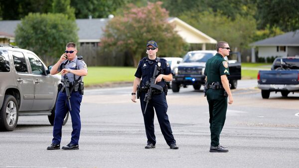 Police officers block off a road after a shooting of police in Baton Rouge, Louisiana, U.S. July 17, 2016. - Sputnik International