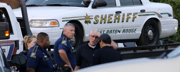 An East Baton Rouge Sheriff vehicle is seen with bullet holes in its windows near the scene where police officers were shot, in Baton Rouge, Louisiana, U.S. July 17, 2016. - Sputnik International