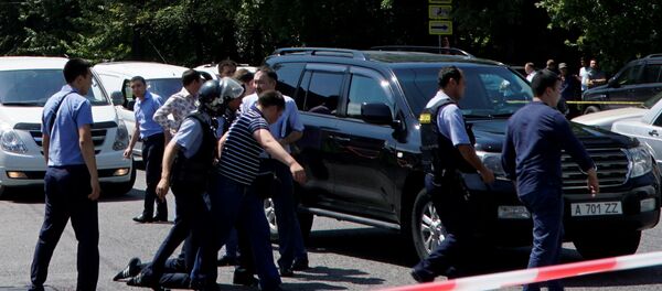 Police officers detain a man after an attack in the centre of Almaty, Kazakhstan, July 18, 2016. Police officers detain a man after an attack in the centre of Almaty, Kazakhstan, July 18, 2016. - Sputnik International