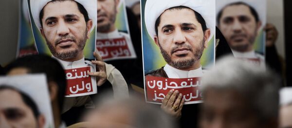 Bahraini men hold placards bearing the portrait of Sheikh Ali Salman, head of the Shiite opposition movement Al-Wefaq, during a protest on May 29, 2016 against his arrest, at Al wefaq headquarter building, in the village of Zinj on the outskirts of the capital Manama. Bahraini men hold placards bearing the portrait of Sheikh Ali Salman, head of the Shiite opposition movement Al-Wefaq, during a protest on May 29, 2016 against his arrest, at Al wefaq headquarter building, in the village of Zinj on the outskirts of the capital Manama. - Sputnik International