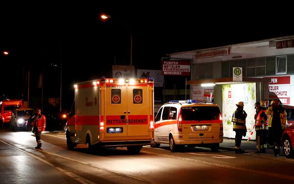 German emergency services workers work in the area where a man with an axe attacked passengers on a train near the city of Wuerzburg, Germany early July 19, 2016 German emergency services workers work in the area where a man with an axe attacked passengers on a train near the city of Wuerzburg, Germany early July 19, 2016 - Sputnik International