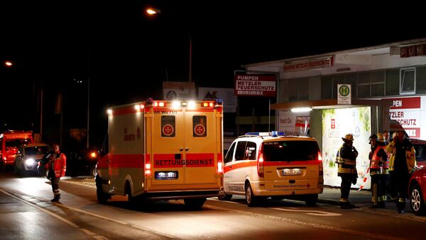 German emergency services workers work in the area where a man with an axe attacked passengers on a train near the city of Wuerzburg, Germany early July 19, 2016 - Sputnik International